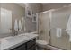 The bathroom includes a white countertop sink and frosted glass enclosed shower, providing a clean and functional space at 872 E Saratoga St, Gilbert, AZ 85296