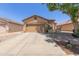 Inviting single-story home with a well-manicured front yard, a two-car garage, and charming curb appeal in a desirable neighborhood at 872 E Saratoga St, Gilbert, AZ 85296
