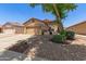 Attractive single-level home with a two-car garage, mature landscaping, and a welcoming front entrance in a peaceful community at 872 E Saratoga St, Gilbert, AZ 85296