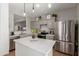 Modern kitchen featuring stainless steel appliances, quartz countertops, and a functional center island at 872 E Saratoga St, Gilbert, AZ 85296