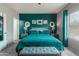 This main bedroom features carpet, an accent wall, neutral-toned walls, and a window with matching curtains at 872 E Saratoga St, Gilbert, AZ 85296