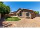 This serene backyard boasts lush landscaping, a playset, and a shade-covered patio at 927 S Ash St, Gilbert, AZ 85233