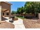 This spacious backyard features a playset, firepit, and well-maintained landscaping at 927 S Ash St, Gilbert, AZ 85233
