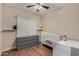 Bright bedroom with wood floors and white baby furniture at 927 S Ash St, Gilbert, AZ 85233