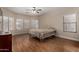 Cozy bedroom with wood floors, neutral walls, and three windows at 927 S Ash St, Gilbert, AZ 85233