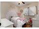 This cheerful bedroom features a rainbow accent wall and charming decor at 927 S Ash St, Gilbert, AZ 85233