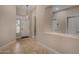 Bright and airy entryway with neutral walls, tiled flooring, and a front door window at 927 S Ash St, Gilbert, AZ 85233
