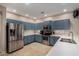 Updated kitchen with stainless steel appliances, ample storage, and light countertops at 927 S Ash St, Gilbert, AZ 85233