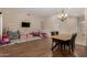 Open-concept living area featuring wood floors, stylish chandelier, and play area at 927 S Ash St, Gilbert, AZ 85233