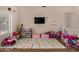 Bright and cheerful playroom featuring a TV and a variety of colorful toys and play mats at 927 S Ash St, Gilbert, AZ 85233