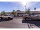 Street view showcasing local businesses and parked trucks on a sunny day at 927 S Ash St, Gilbert, AZ 85233
