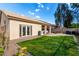 Beautiful backyard features lush green grass, a tiled roof, and an outdoor patio at 1022 S Butte Ln, Gilbert, AZ 85296