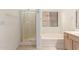 Bathroom featuring walk-in shower and separate tub next to a window at 1022 S Butte Ln, Gilbert, AZ 85296