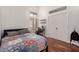 Bedroom with closet, wood floors, and window with shutters at 1022 S Butte Ln, Gilbert, AZ 85296