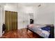 Bedroom with wood floors and curtained closet at 1022 S Butte Ln, Gilbert, AZ 85296