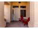 Inviting front entrance with cozy red Adirondack chairs, perfect for enjoying outdoor living at 1022 S Butte Ln, Gilbert, AZ 85296