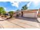 Charming single-story home featuring a two-car garage and a well-maintained, xeriscaped front yard at 1022 S Butte Ln, Gilbert, AZ 85296
