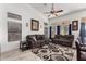 Inviting living room with vaulted ceilings, neutral paint, updated fan, and comfortable furnishings at 1022 S Butte Ln, Gilbert, AZ 85296