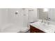 Bathroom featuring shower-tub combo, white toilet, and dark wood vanity at 10693 N Arapaho Dr, Casa Grande, AZ 85122