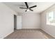 Neutral bedroom with a ceiling fan and large closet at 10693 N Arapaho Dr, Casa Grande, AZ 85122