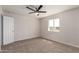 Neutral bedroom with a ceiling fan and natural light from the window at 10693 N Arapaho Dr, Casa Grande, AZ 85122