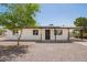 Charming single-story home with a well maintained yard, covered entry, and convenient covered parking at 10693 N Arapaho Dr, Casa Grande, AZ 85122