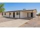 Single-story home featuring a driveway, simple covered entry, and convenient covered parking at 10693 N Arapaho Dr, Casa Grande, AZ 85122