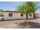 Single-story home featuring a gravel yard, covered entry, and convenient covered parking at 10693 N Arapaho Dr, Casa Grande, AZ 85122
