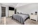 Comfortable bedroom features a ceiling fan, carpet, and a neutral color scheme at 10913 W Caron Dr, Sun City, AZ 85351
