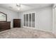This bedroom features natural light and carpeted floors and neutral walls at 10913 W Caron Dr, Sun City, AZ 85351