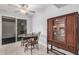 Cozy dining area featuring a sliding glass door to the exterior and a stylish cabinet at 10913 W Caron Dr, Sun City, AZ 85351
