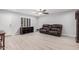 Bright living room with new floors, ceiling fan and comfortable furniture with an open and airy layout at 10913 W Caron Dr, Sun City, AZ 85351
