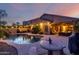 Backyard featuring a private pool, covered patio and outdoor seating area at 11829 W Patrick Ln, Sun City, AZ 85373