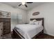 Relaxing bedroom with a cozy bed, dresser, and a window for natural light at 11829 W Patrick Ln, Sun City, AZ 85373