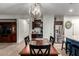 Dining room with cabinets and bar area open to the kitchen at 11829 W Patrick Ln, Sun City, AZ 85373