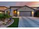 Charming single-story home with desert landscaping, and a two car garage at 11829 W Patrick Ln, Sun City, AZ 85373