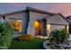 Lovely home showcasing artificial turf, desert landscaping, and an arched entryway at 11829 W Patrick Ln, Sun City, AZ 85373
