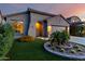 Attractive single-story home with landscaped front yard, synthetic lawn and desert landscaping at 11829 W Patrick Ln, Sun City, AZ 85373