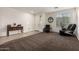 Welcoming living room with tile entry, and large front window at 11829 W Patrick Ln, Sun City, AZ 85373