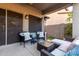 Cozy covered patio offers comfortable seating and a relaxing outdoor living space at 11829 W Patrick Ln, Sun City, AZ 85373