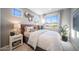 Bedroom showcasing large windows for natural light, modern decor, and neutral paint at 12233 W Caraveo Pl, Peoria, AZ 85383