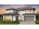 Contemporary two-story home with a mix of textures, large windows, and a spacious two-car garage at 12233 W Caraveo Pl, Peoria, AZ 85383
