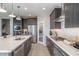 Modern kitchen featuring stainless steel appliances, a kitchen island and lots of storage at 12233 W Caraveo Pl, Peoria, AZ 85383