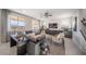 Bright living room boasts natural light, stylish decor, and comfortable seating at 12233 W Caraveo Pl, Peoria, AZ 85383