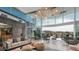 Bright clubhouse lounge with modern furnishings, high ceilings, and mountain views at 12233 W Caraveo Pl, Peoria, AZ 85383