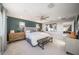 Spacious main bedroom features a large window, decorative furnishings, and adjoining primary ensuite access at 12233 W Caraveo Pl, Peoria, AZ 85383