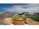 Community playground near the pool features modern equipment and desert views at 12233 W Caraveo Pl, Peoria, AZ 85383