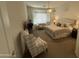 Spacious bedroom showcasing a cozy seating area and bay windows for ample light at 14991 W Shaw Butte Dr, Surprise, AZ 85379