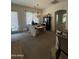 Cozy dining area with a chandelier, access to outdoor patio, and comfortable seating at 14991 W Shaw Butte Dr, Surprise, AZ 85379