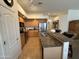 Functional kitchen with a breakfast bar, stainless steel appliances, and tile flooring at 14991 W Shaw Butte Dr, Surprise, AZ 85379
